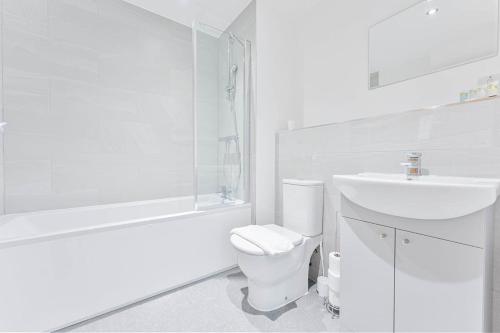 a white bathroom with a toilet and a sink at Characterful 1 Bed Apartment in Central Nottingham in Nottingham