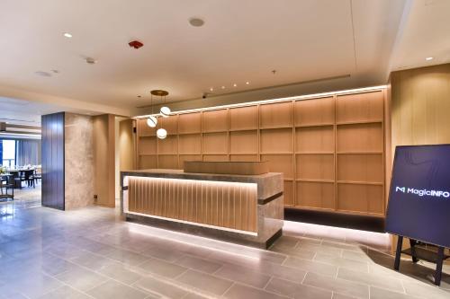 a lobby of a hotel with a reception desk at Four Points by Sheraton Taipei Bali in Bali
