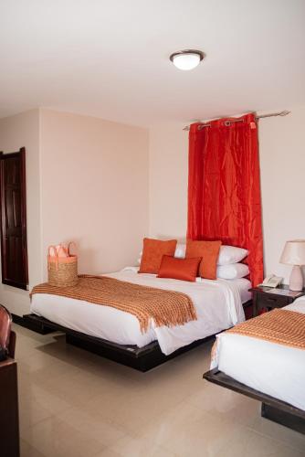 Ein Bett oder Betten in einem Zimmer der Unterkunft Sunset Harmony, Your Escape at Playa Hermosa