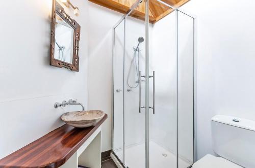 a bathroom with a sink and a shower at Beachview Bungalow Warrnambool in Warrnambool