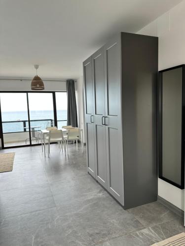a living room with a table and chairs at Aloha Playa Sol y Mar in Benalmádena