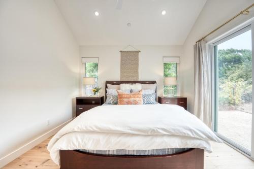 a bedroom with a large bed and a window at Bright Retreat in Solana Beach