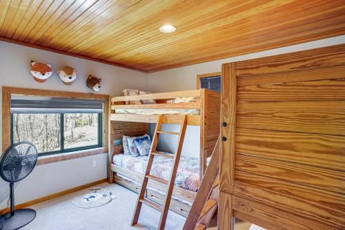 a bedroom with two bunk beds and a window at Wilmington Retreat with Deck, Lake Views and Game Room in Wilmington