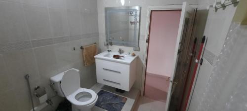 a bathroom with a toilet and a sink and a shower at Tranquil Oasis in the Heart of Ifrane in Ifrane