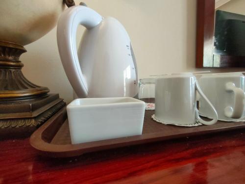 a tea kettle and two cups on a tray at INGOING Marina in El Alamein