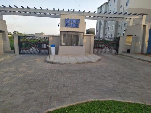 a building with a sign that reads bank shuttle at Vipingo Nomadic Apartment in Tezo