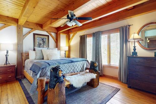 a bedroom with a bed and a ceiling fan at Sunset Ridge in Sapphire