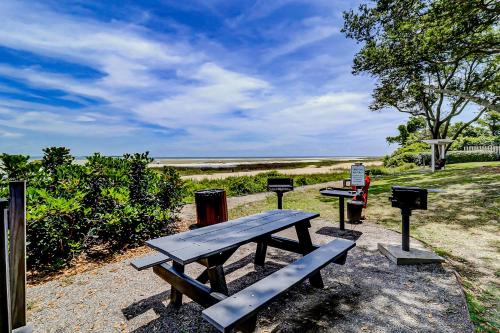 a picnic table and bbq equipment in a park at Spa on Port Royal Sound 2101 in Hilton Head Island
