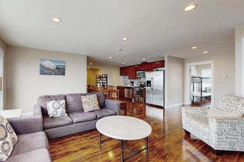 a living room with a couch and a table at The Whale -Upper in Lincoln City