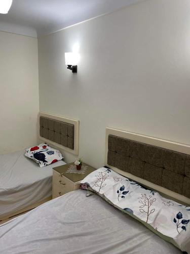 Katil atau katil-katil dalam bilik di Rental Apartment Sea View