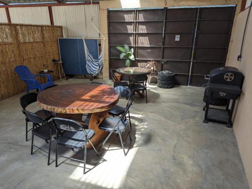 a room with two tables and chairs and a table and a grill at El Nido Lodge in Monteverde Costa Rica