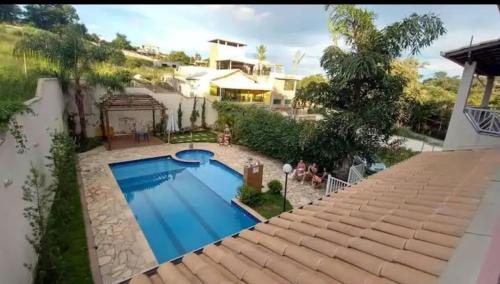 a view from the roof of a house with a swimming pool at SITIO AMANHECER VERDE in Contagem