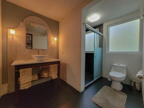 a bathroom with a sink and a toilet at Villas Valle in Valle de Bravo