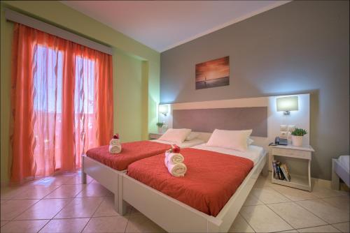 Postel nebo postele na pokoji v ubytování Anemona Beach Hotel