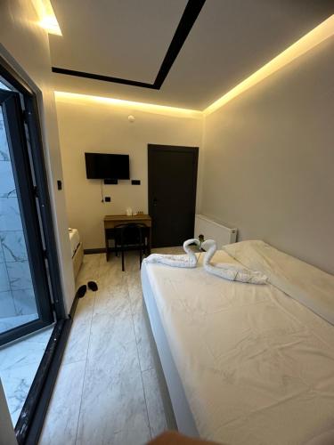 Katil atau katil-katil dalam bilik di Antik Otel