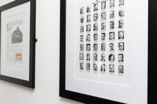 a framed picture of people on a wall at The Sir Thomas Hotel in Liverpool