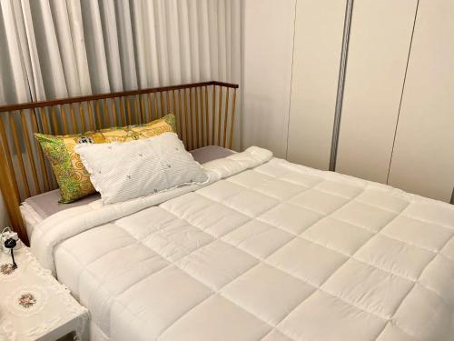 a small bedroom with a bed and a pillow at Gangnam Station Fun House in Seoul