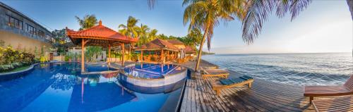 Kolam renang di atau di dekat Paradise Palm Beach Bungalows and Dive Center