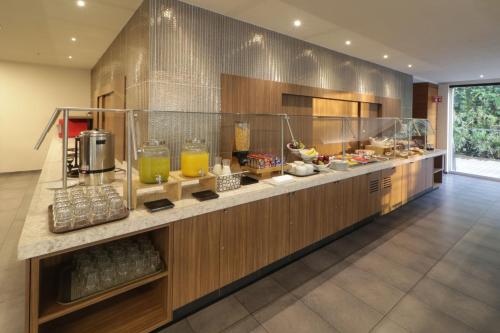 a kitchen with a counter with food on it at City Express Plus by Marriott Ciudad de México Santa Fe in Mexico City
