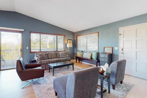 a living room with a couch and a table at Evergreen in Depoe Bay