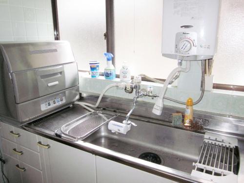 a kitchen counter with a mixer and a sink at Kyoto - House / Vacation STAY 14527 in Kyoto