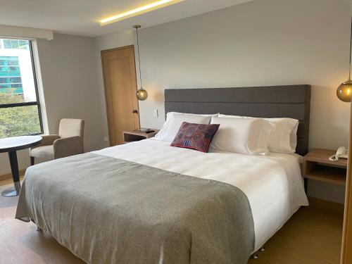 Postel nebo postele na pokoji v ubytování Hotel Parque 97 Suites