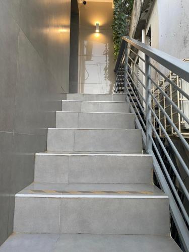 a set of stairs leading up to a house at Room in Samana in Santa Bárbara de Samaná