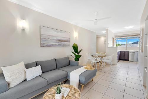 a living room with a couch and a table at 'Poolside at Whitfield Waters' Resort-style Retreat in Edge Hill