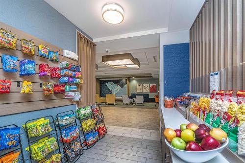 a grocery store with a display of fruits and vegetables at Holiday Inn Express & Suites Charleston Arpt-Conv Ctr Area by IHG in Charleston