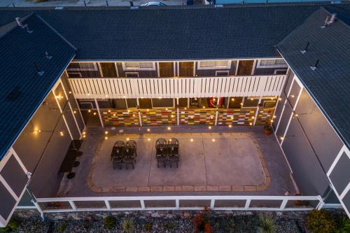 an overhead view of a building with a patio with chairs at Gateway Lodge in Seaside