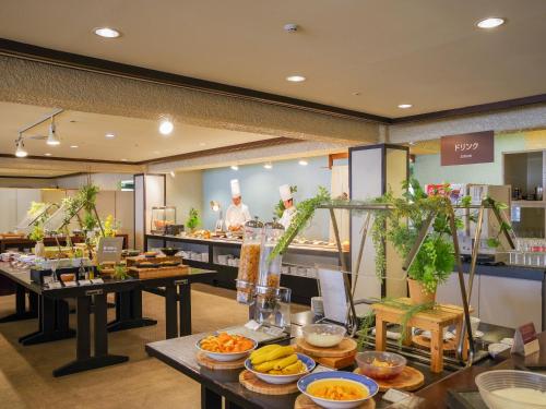 a buffet line with many different types of food at Manza Kogen Hotel in Tsumagoi