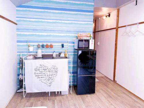 A cozinha ou cozinha compacta de Akira&chacha杉並区世田谷direct to shinjuku for 13 min 上北沢4分 近涉谷新宿