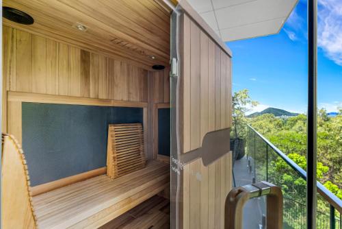 a room with a balcony with a view at Ohana - The Ultimate Family Pool Escape in Kewarra Beach