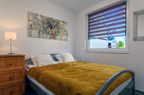 Postel nebo postele na pokoji v ubytování Apartament Wiatrakowa