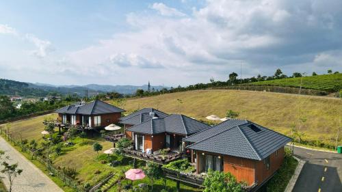 an overhead view of a row of houses on a hill at Ogimi Villas Bảo Lộc in Blao Srê