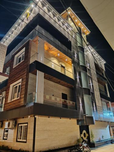 a rendering of a building at night at MG apartments in Jodhpur