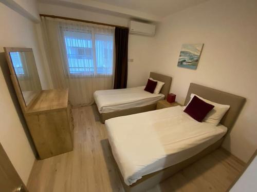Ένα ή περισσότερα κρεβάτια σε δωμάτιο στο Private Flat in Famagusta Center with Hotel Perks
