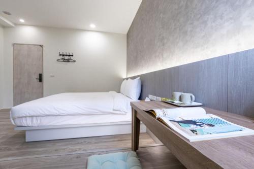 Postel nebo postele na pokoji v ubytování hōo落雨 溫泉旅店