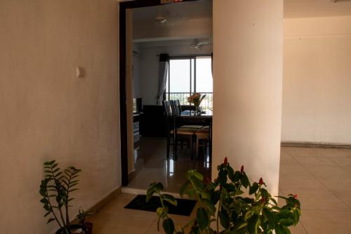 a living room with a table and a dining room at Lovish luxury villa in Colombo