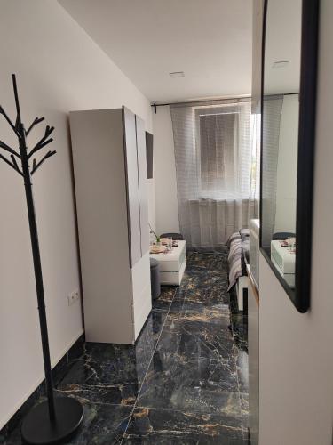 a bathroom with a plant in the middle of the room at Súkromný luxusný apartmán in Hlohovec