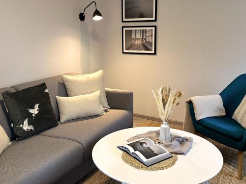a living room with a couch and a table at Zirchow, Appartement No 1 in Zirchow