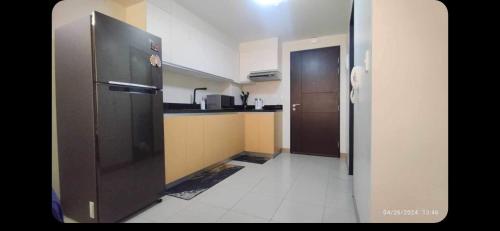 Kuchyň nebo kuchyňský kout v ubytování 1BR with extra room at One Regis- Megaworld