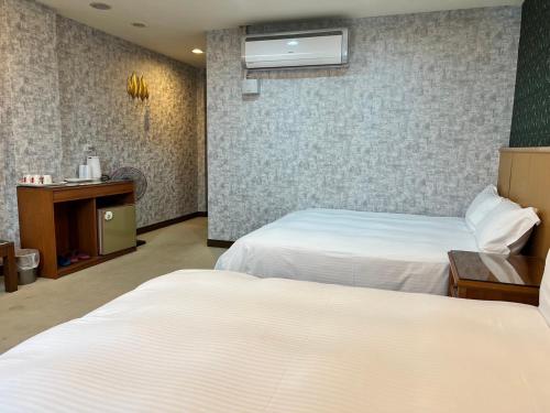 Postel nebo postele na pokoji v ubytování Mucha Boutique Hotel