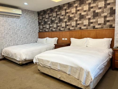 Postel nebo postele na pokoji v ubytování Mucha Boutique Hotel