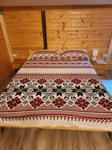 Katil atau katil-katil dalam bilik di Refugiul Rustic