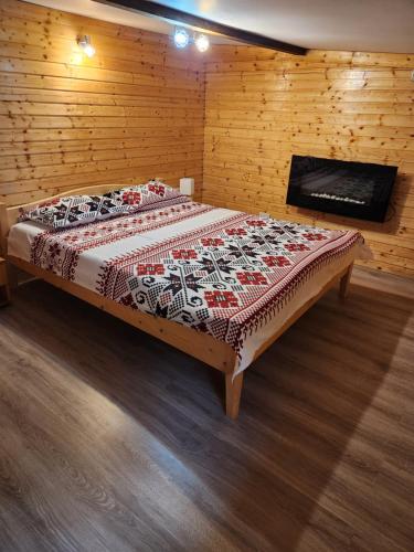 Katil atau katil-katil dalam bilik di Refugiul Rustic