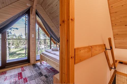 Ένα ή περισσότερα κρεβάτια σε δωμάτιο στο Forest Princess Chalet - Happy Rentals