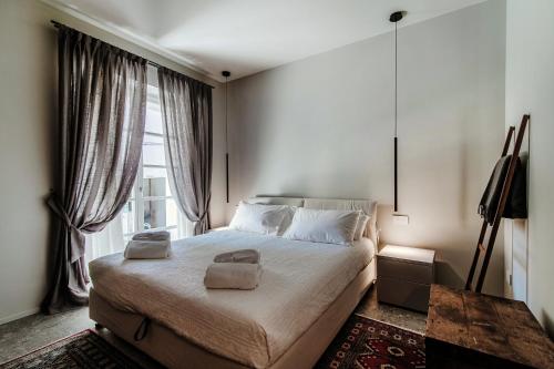 Katil atau katil-katil dalam bilik di Lake Como Suites- LA TERRAZZA