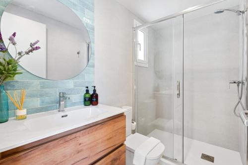 a bathroom with a sink and a shower at Lodging Apartments Barceloneta Beach Studio 32 in Barcelona