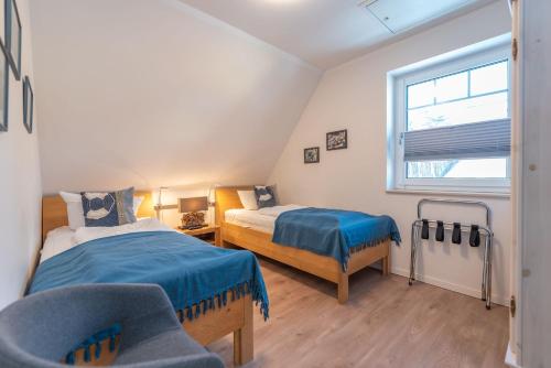 Postel nebo postele na pokoji v ubytování Ferienhaus Meerzeit